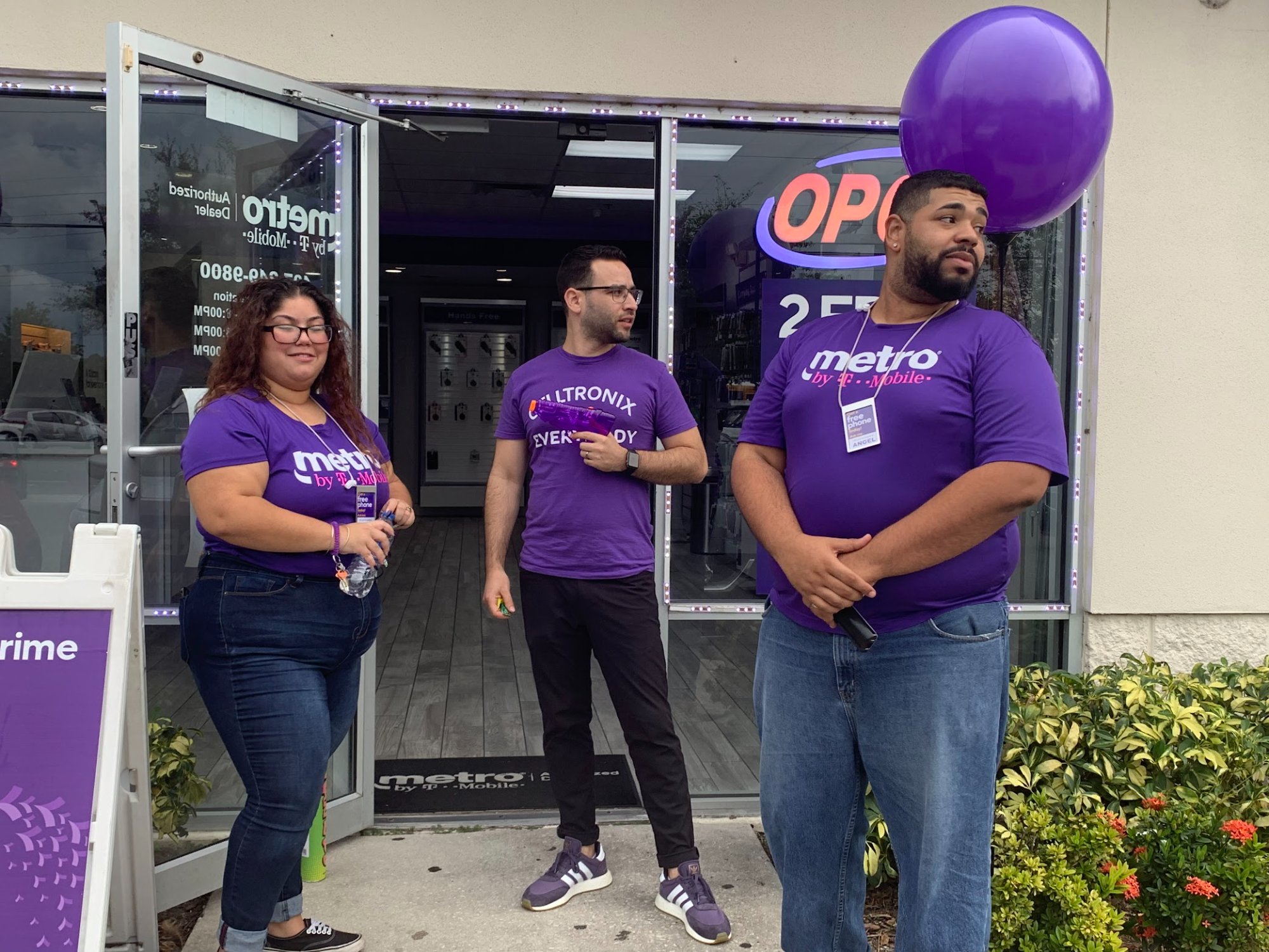 Evan Ross and the Celltronix team outside a Metro by T-Mobile store