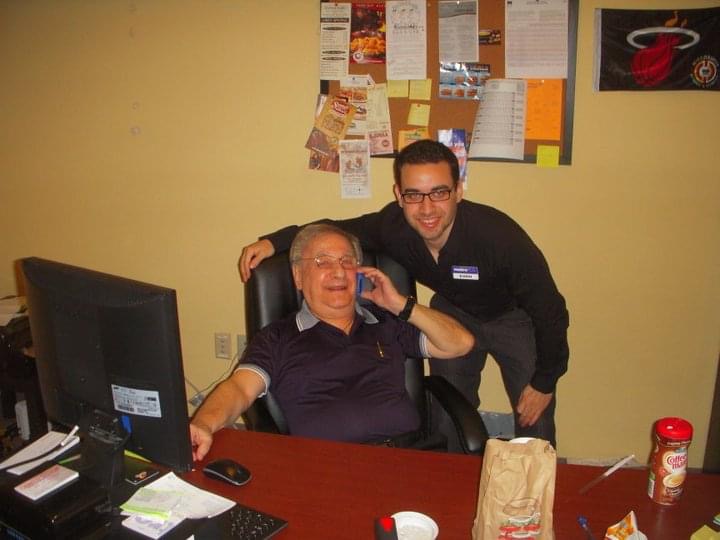 Evan and his grandfather at the first Celltronix office